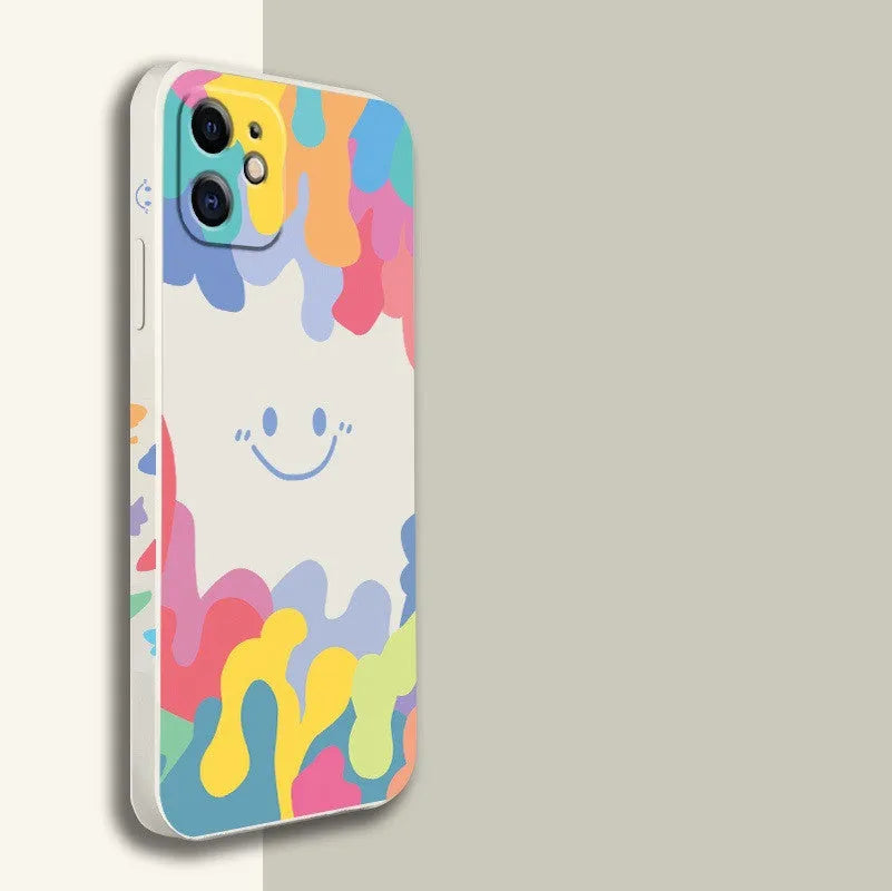 White silicone iPhone case with rainbow smiley face pattern and attached lanyard