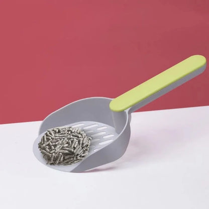 Blue plastic cat litter shovel scoop with drainage holes for cleaning a litter box.