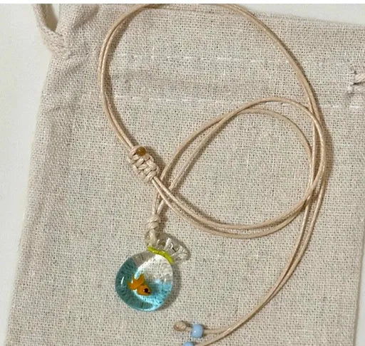 Women's necklace with coloured glaze pendant on a cotton-linen chain, showcasing world-style design