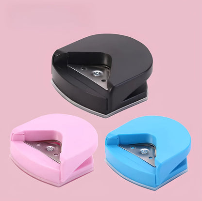 Black plastic and metal business card corner cutter on a white background