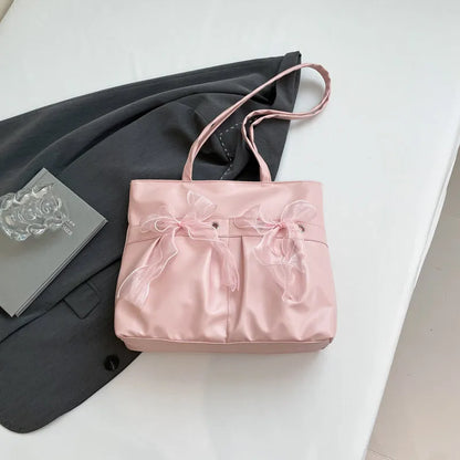 College style bow tote bag with large main compartment and internal zipper organiser in black colour