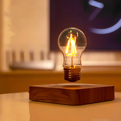 Self-rotating maglev LED bulb levitating above circular base with warm yellow illumination