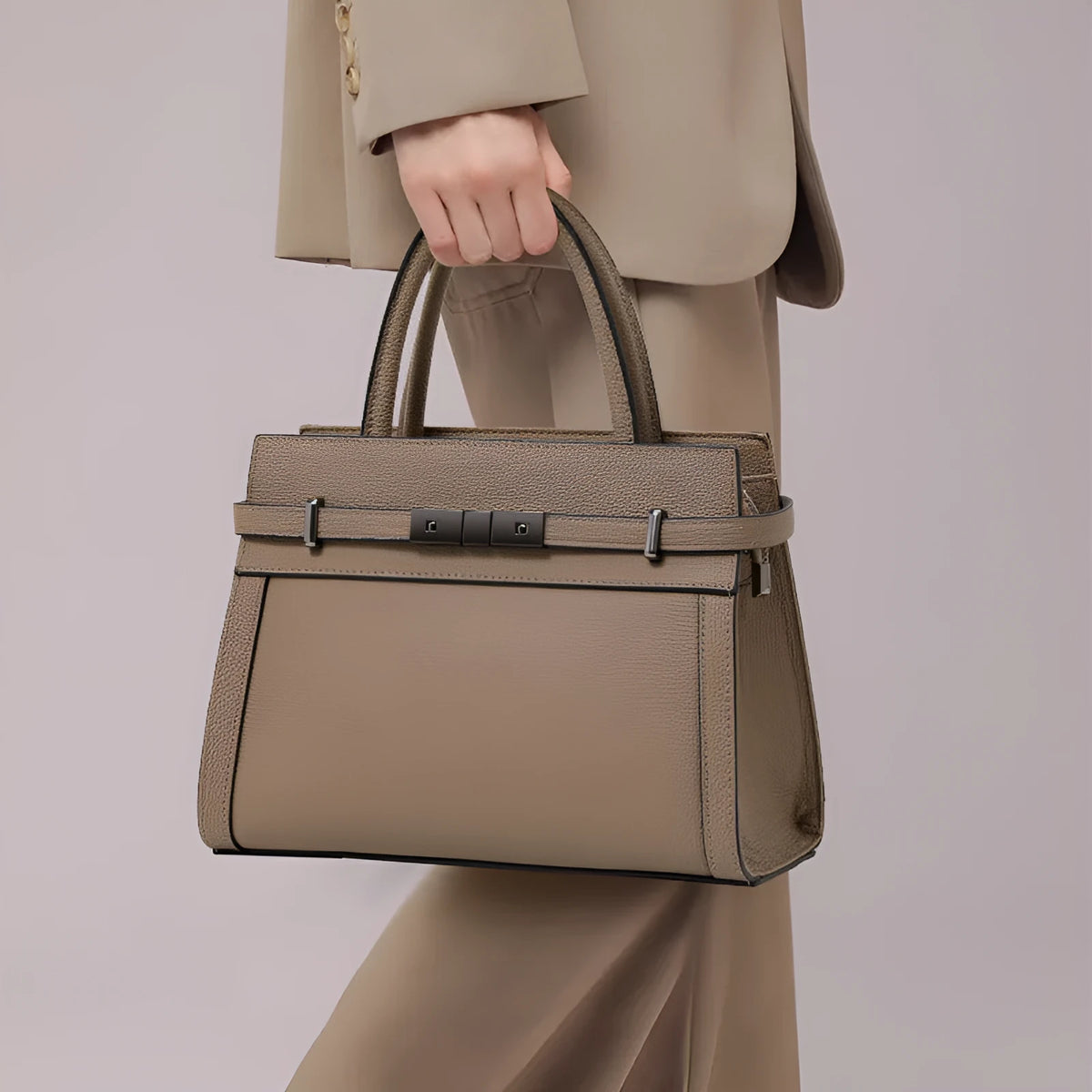 Women's square genuine leather crossbody handbag in clamshell style with internal compartments.