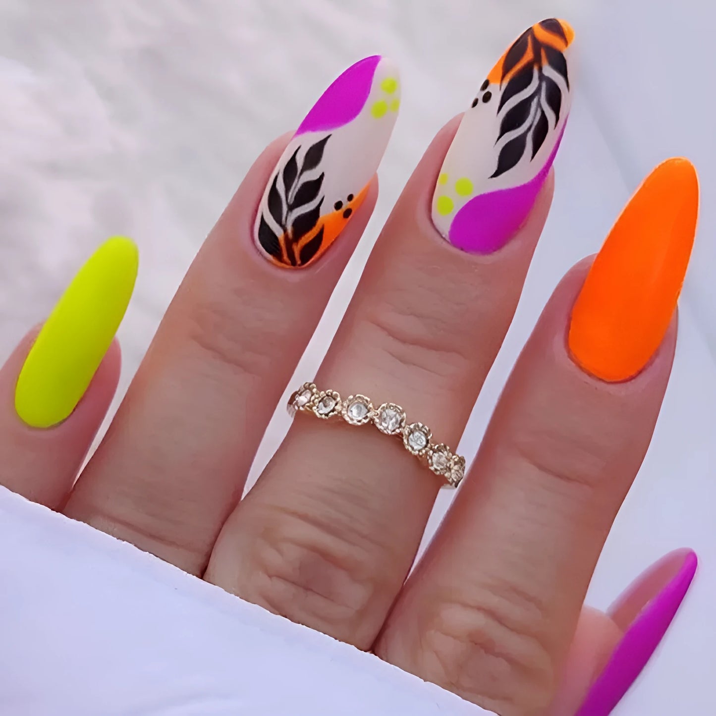Almond armour shaped nail stickers with frosted finish showing four decorative colour options