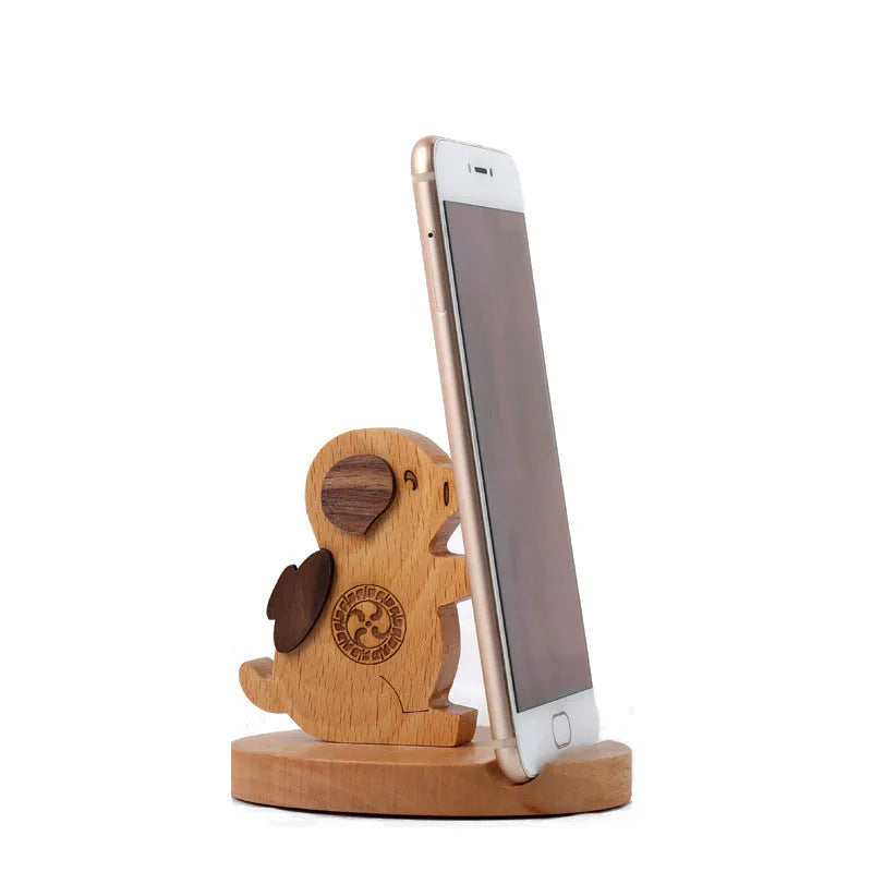 Beech wood mobile phone holder with coin slot showing adjustable angle and resin decorative elements