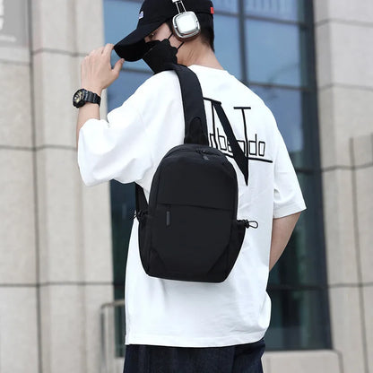 Grey waterproof polyester chest bag with shoulder strap showing 33cm height and 20cm width dimensions