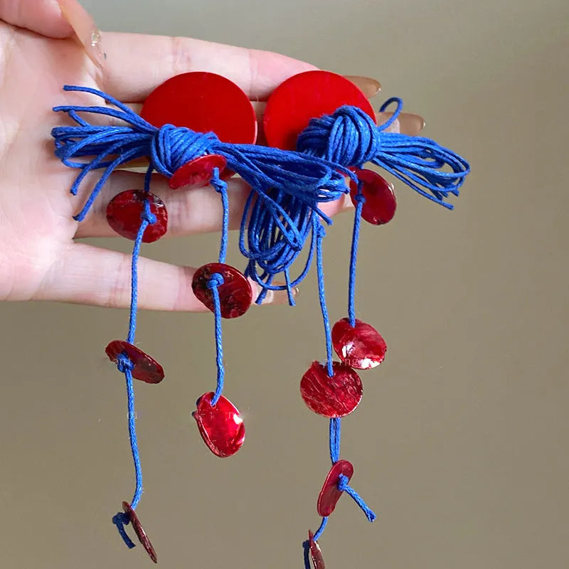 Geometric blue cloth women's earrings with round elements and a handcrafted finish.