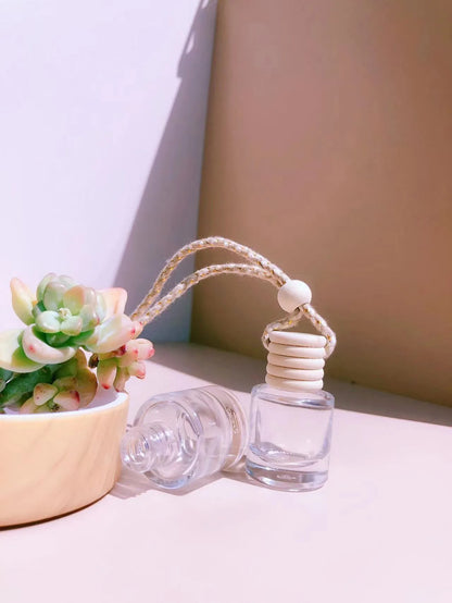 Car perfume pendant in four glass bottle styles: cylinder, diamond, flat drum, and square