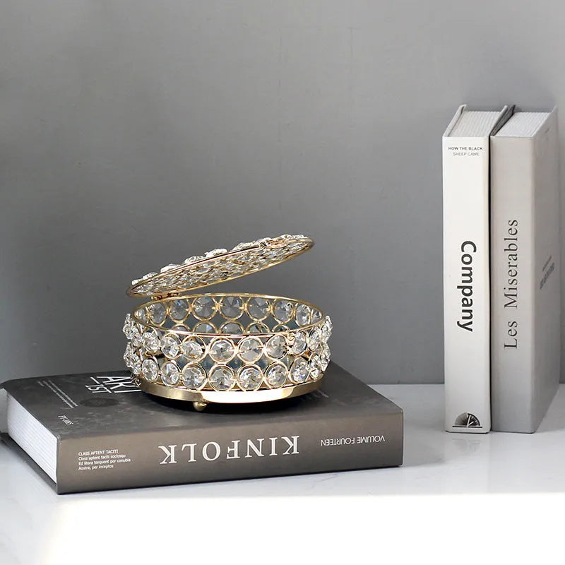 French gold iron jewellery box with crystal glass panels showing jewellery inside