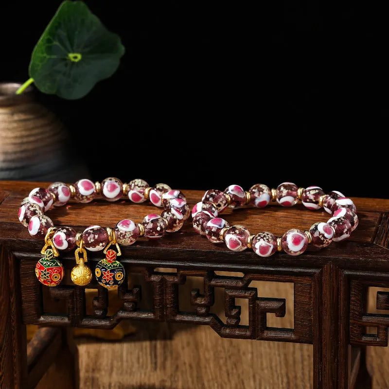 Handmade glass bracelet with 10mm swallowing gold beast cherry blossom heart charm in six colour options