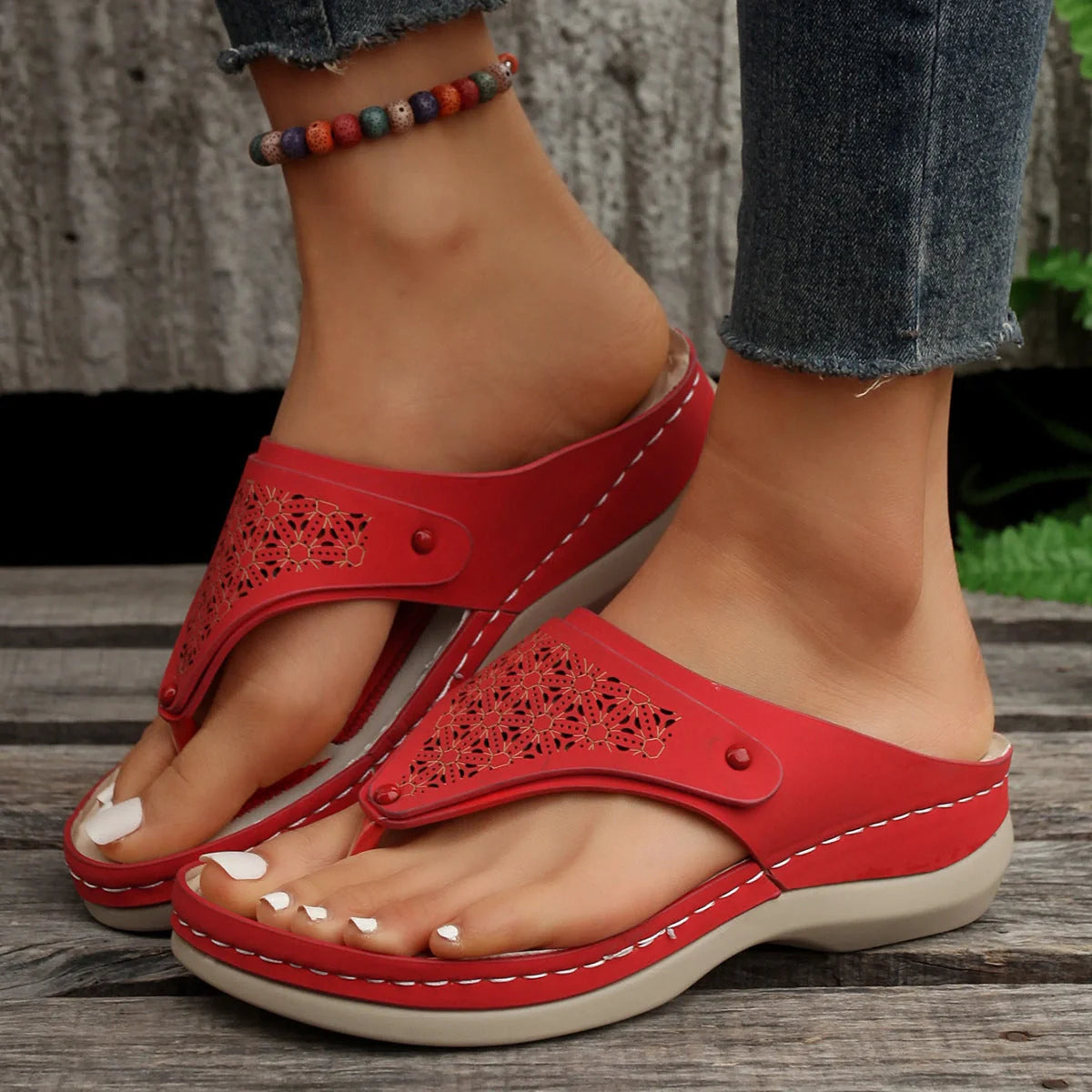 Women's PU thong sandals in various colors, showcasing segmented toe design