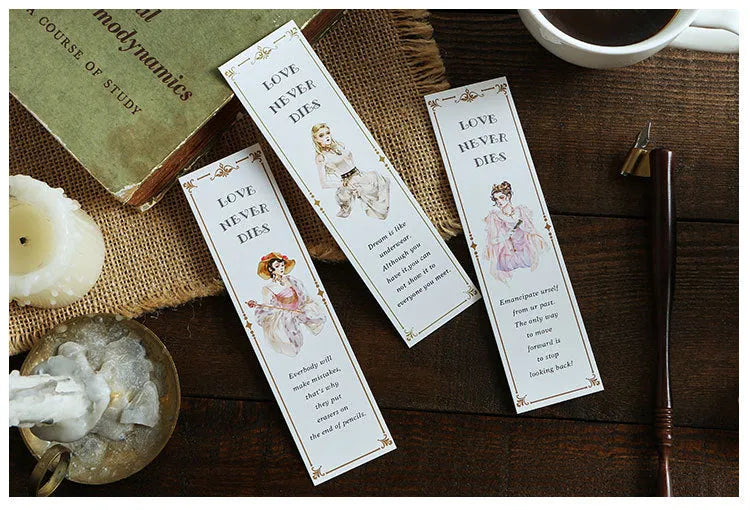 Pack of 30 white cardboard bookmarks with four artistic designs, measuring 40 by 150 millimetres.