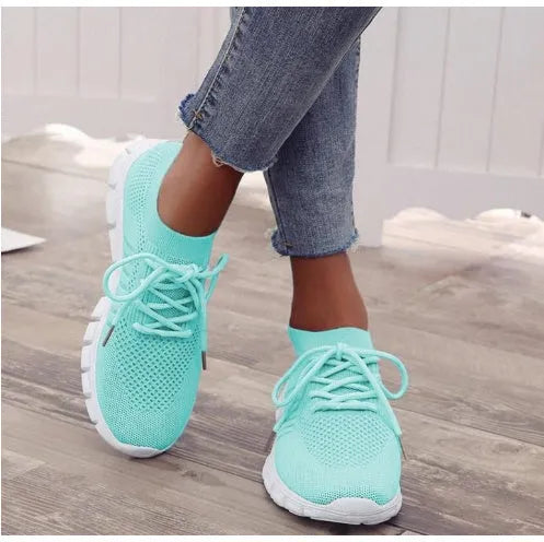 Women's lace-up platform sneaker in multiple colours with a low-top profile and rubber sole.