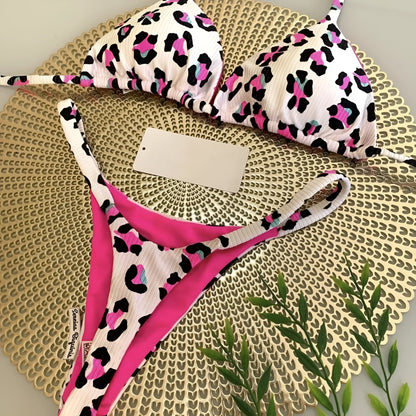 Women's printed bikini swimsuit with briefs style and cotton lining on a mannequin.