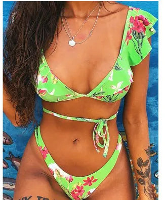 Yellow floral print split bikini swimsuit set with top and pants on a mannequin.