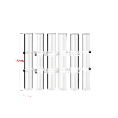 Clear glass hinged test tube vase with plants in curved arrangement