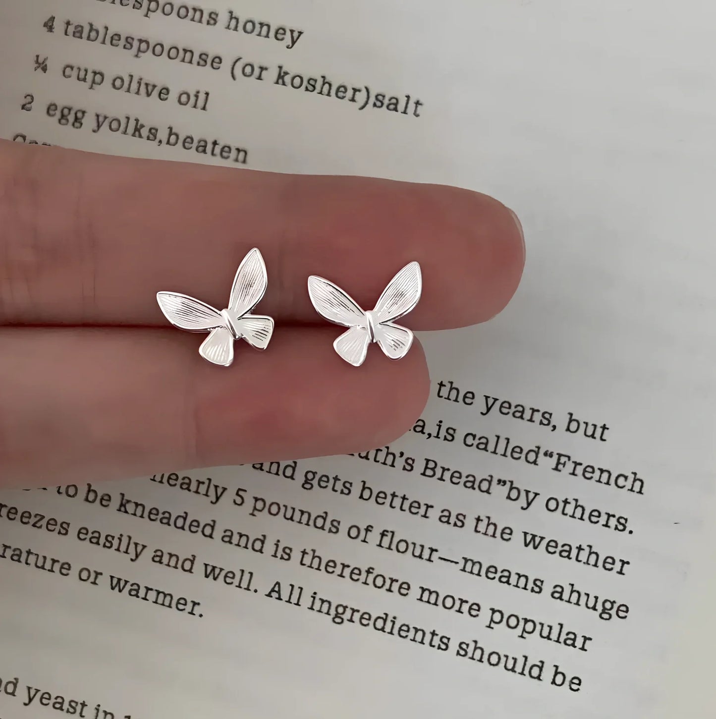 Sweet tridimensional butterfly stud earrings with textured design and electroplated finish