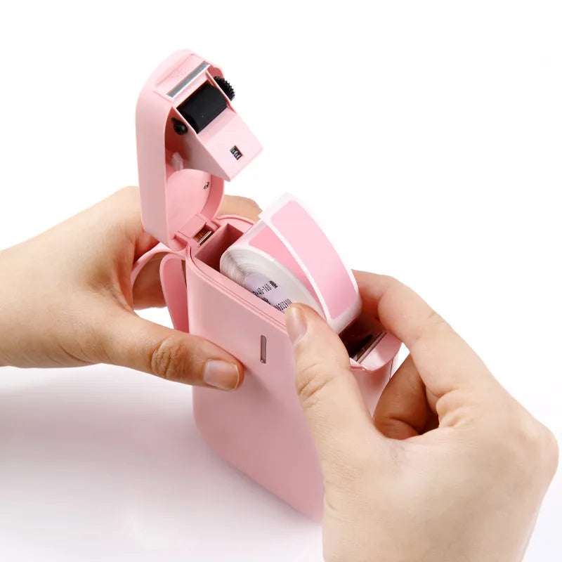D11 Bluetooth thermal label printer in black, showing compact design and smartphone app connection