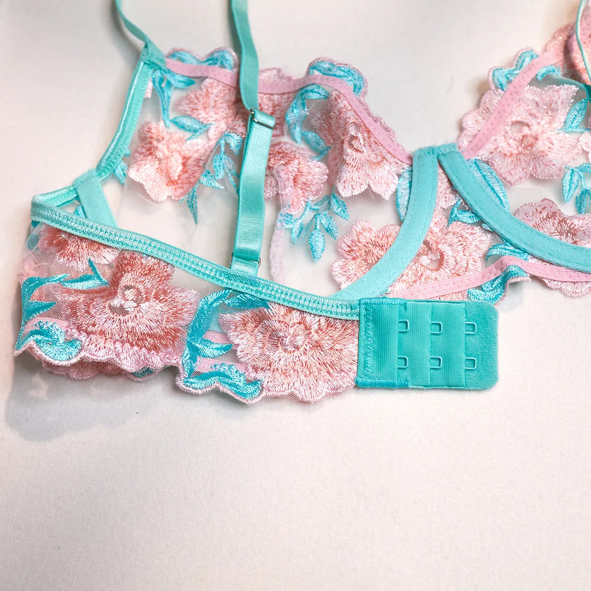 Pink mesh pettiskirt and bikini top set with embroidery detailing on lightweight polyester fabric