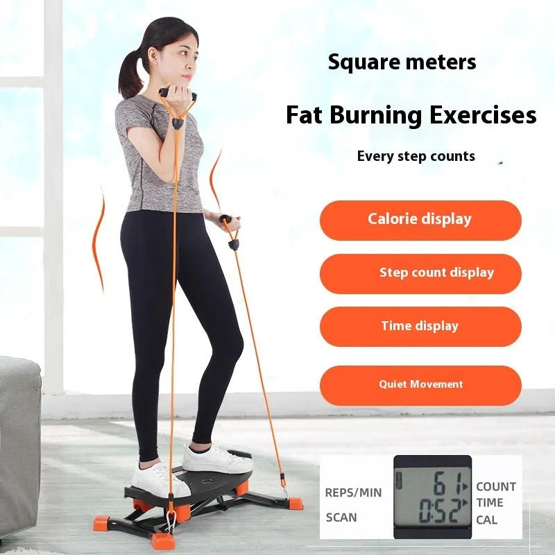Black JS101A mini fitness skiing machine with elastic hand straps on a home floor, showing compact size.