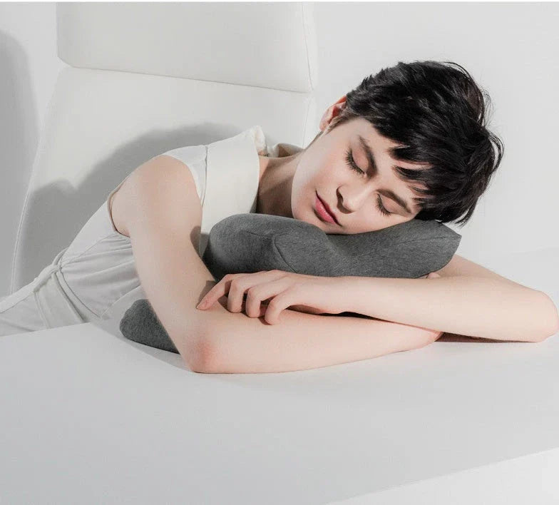 Ergonomic memory foam nap pillow with unique 'butterfly' shape design for comfortable desk or classroom power naps