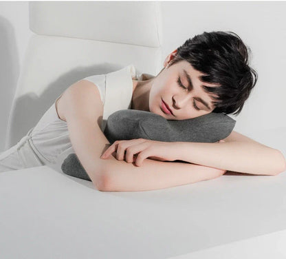 Ergonomic memory foam nap pillow with unique 'butterfly' shape design for comfortable desk or classroom power naps