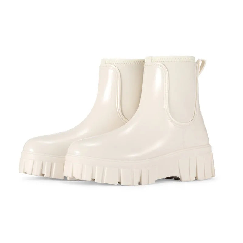 PVC low tube rain boots in apricot colour with non-slip sole and flat heel design