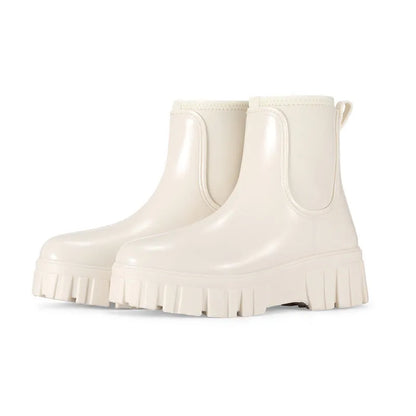 PVC low tube rain boots in apricot colour with non-slip sole and flat heel design