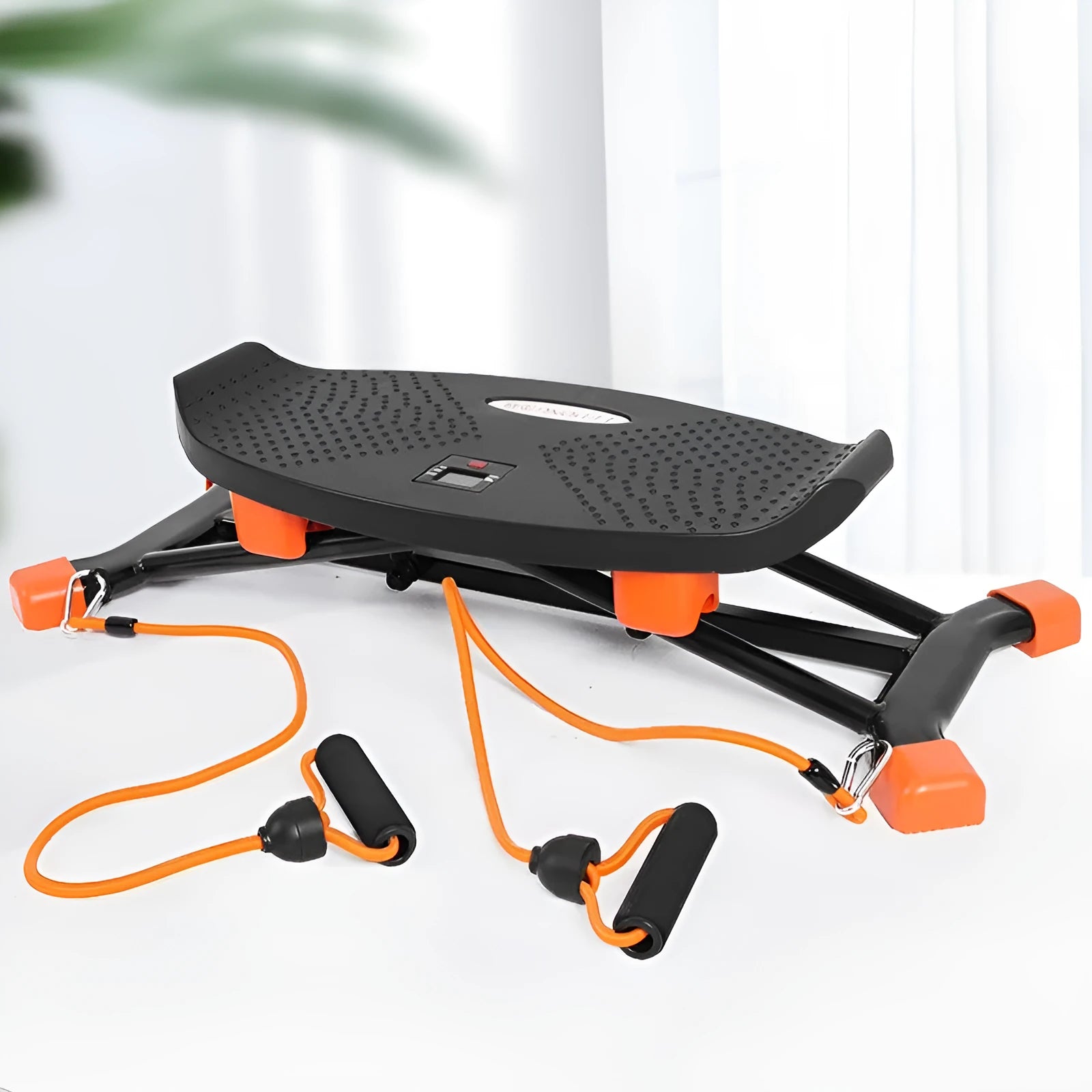 Black JS101A mini fitness skiing machine with elastic hand straps on a home floor, showing compact size.