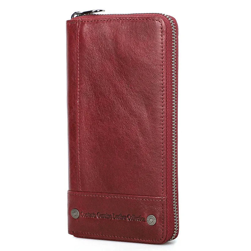 Men's brown genuine cowhide leather long wallet open to show card slots, RFID protection symbol, and zippered coin section.
