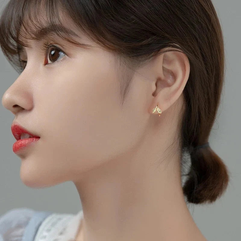 Handmade S925 sterling silver branch bud earrings in gold and white gold finishes.