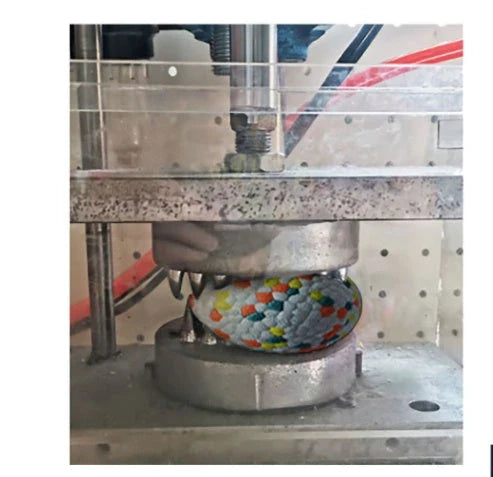 Interactive chew toy ball for dogs, featuring a durable TPU construction and corn grain design to clean teeth while playing