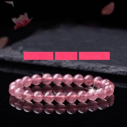 Women's strawberry quartz crystal bracelet with mixed 6mm, 8mm, and 10mm polished beads.