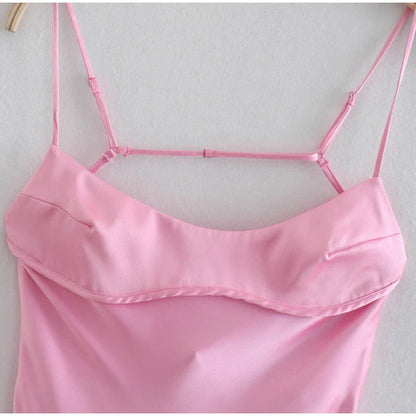 Elegant satin slip dress in pink with a flattering, form-fitting silhouette and sexy backless design