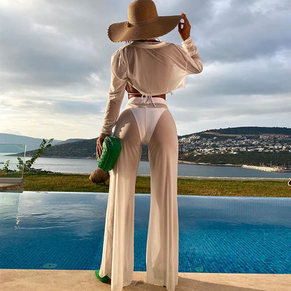 White women's high-waist backless swimsuit four-piece set on a hanger.