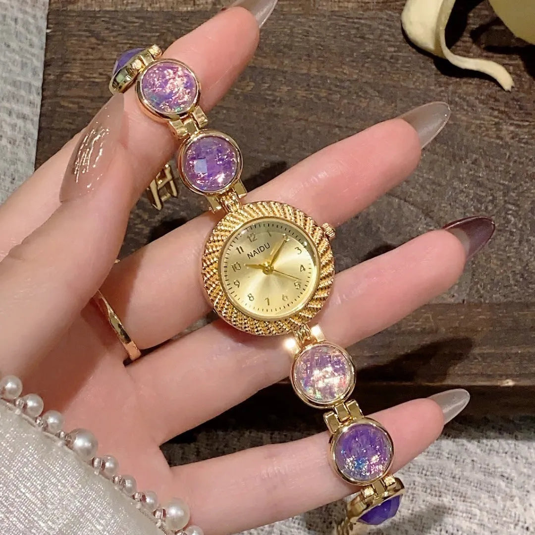 Women's quartz watch with 25mm round dial in milky white, on a zinc alloy case.
