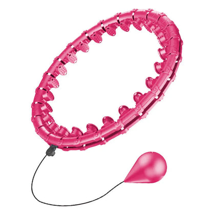 Pink massage soft ball with a detachable black belt, shown on a fitness mat.