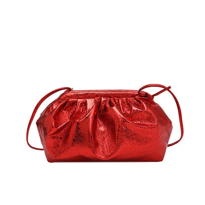 Simple hair clip closure crossbody bag in shell shape with sewing line detail on rose red PU material