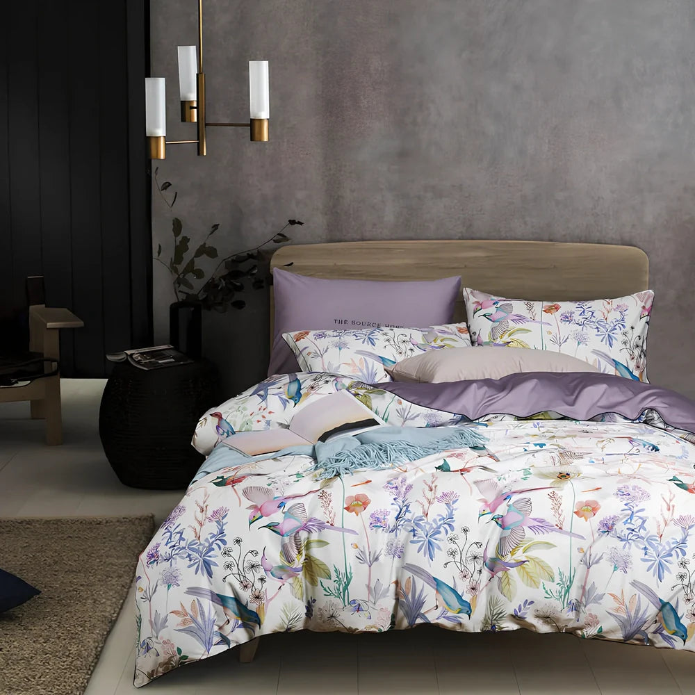 Four-piece cotton bedding set with floral pattern showing fitted sheet, duvet cover, and two pillowcases