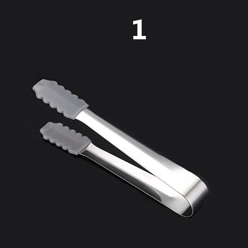 Set of eight stainless steel whiskey cooling stones with metal clip in plastic storage container