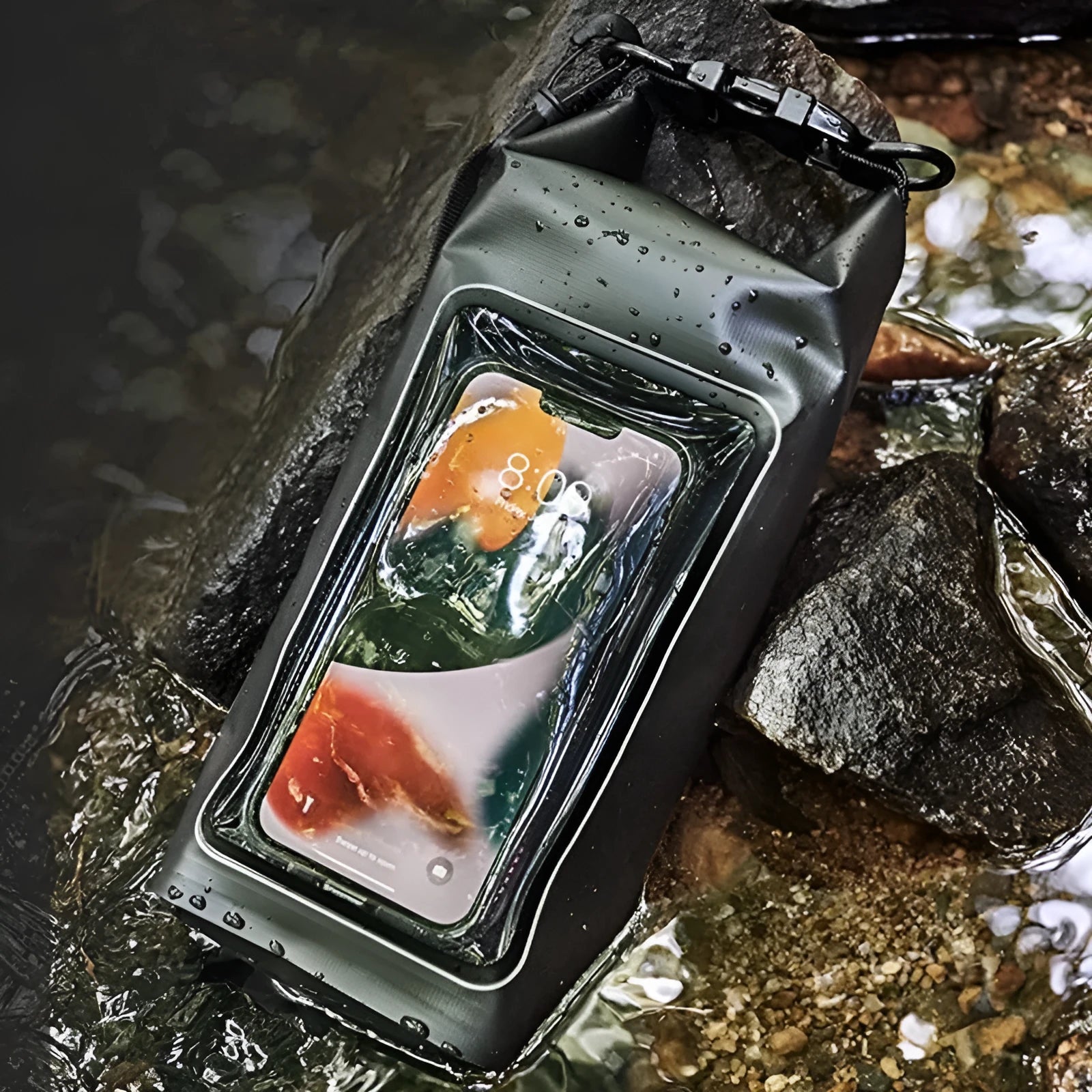 Army green PVC waterproof crossbody bag for mobile phones on a beach.
