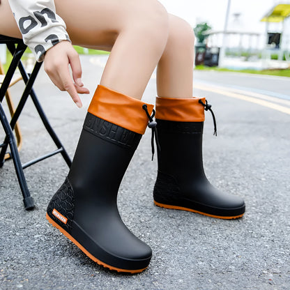 Women's solid colour PVC rain boots with non-slip soles in apricot, black, brown, or pink