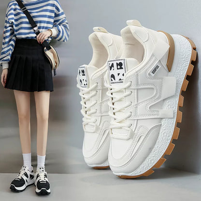 Women's low-top running sneaker in white or black with rubber sole