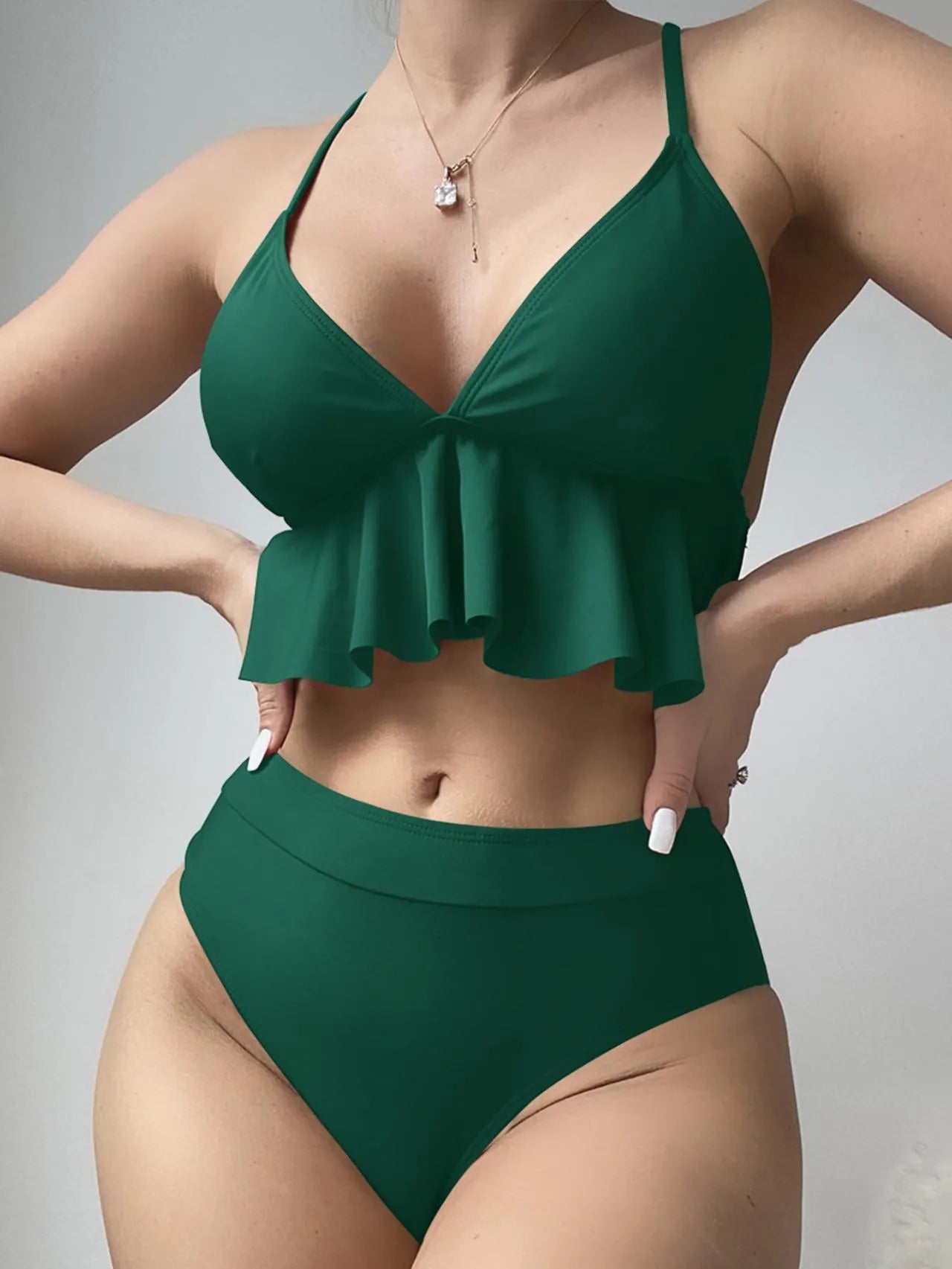 Women's solid colour split bikini swimsuit in black, green, red, or blue.