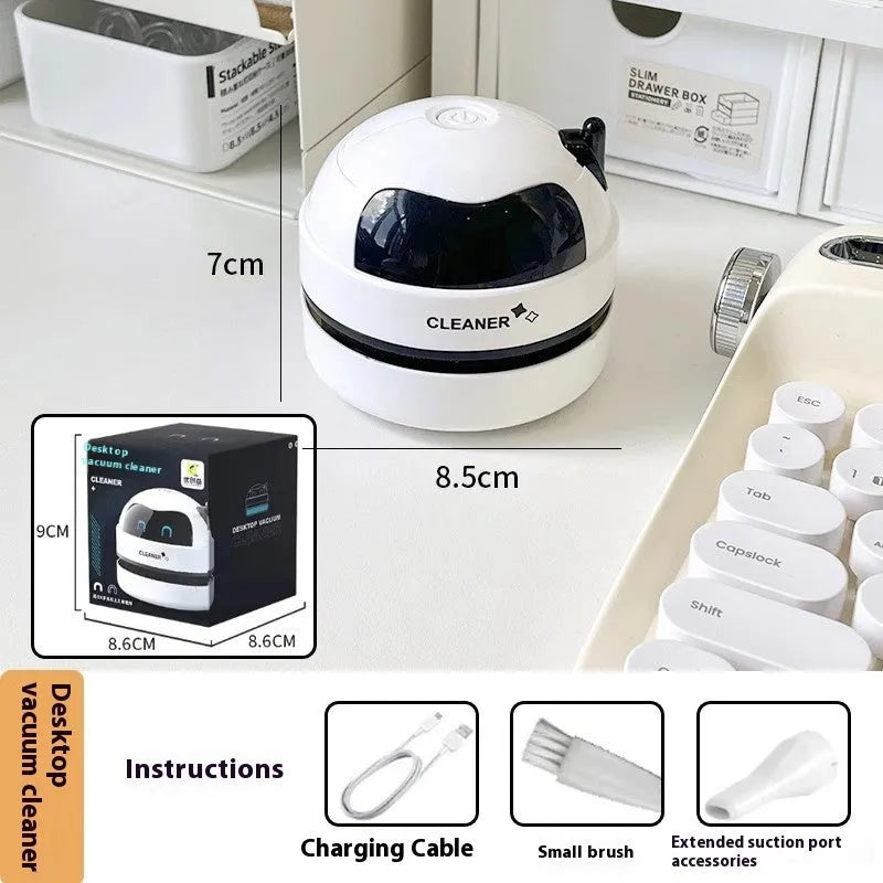 USB-powered handheld desktop vacuum cleaner in blue colour cleaning computer keyboard