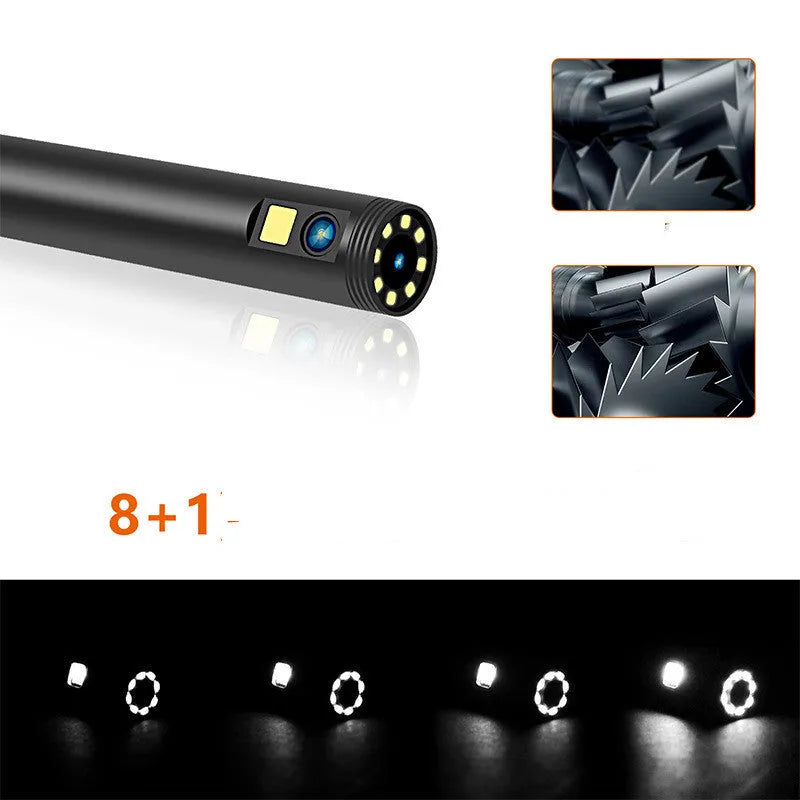 Wireless dual-lens inspection endoscope with IP68 waterproof probe, magnet, and hook accessories on a table.