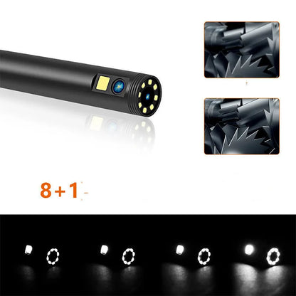 Wireless dual-lens inspection endoscope with IP68 waterproof probe, magnet, and hook accessories on a table.