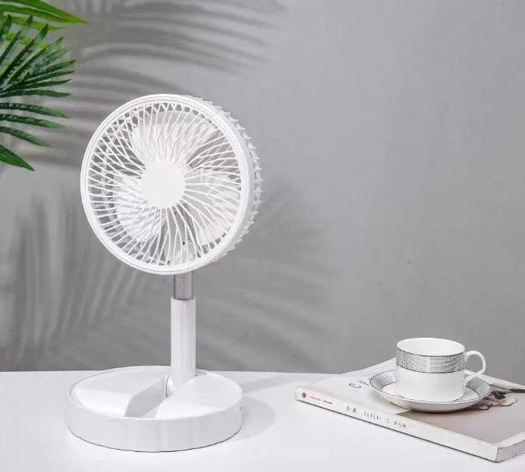 Black telescopic portable folding fan shown extended to full height on a desk, with control panel visible.