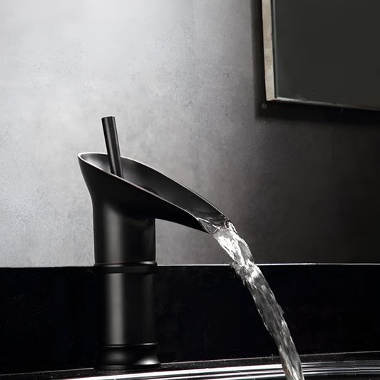 Brass basin faucet with a wine glass shaped spout in a choice of black, gold, or silver finish.