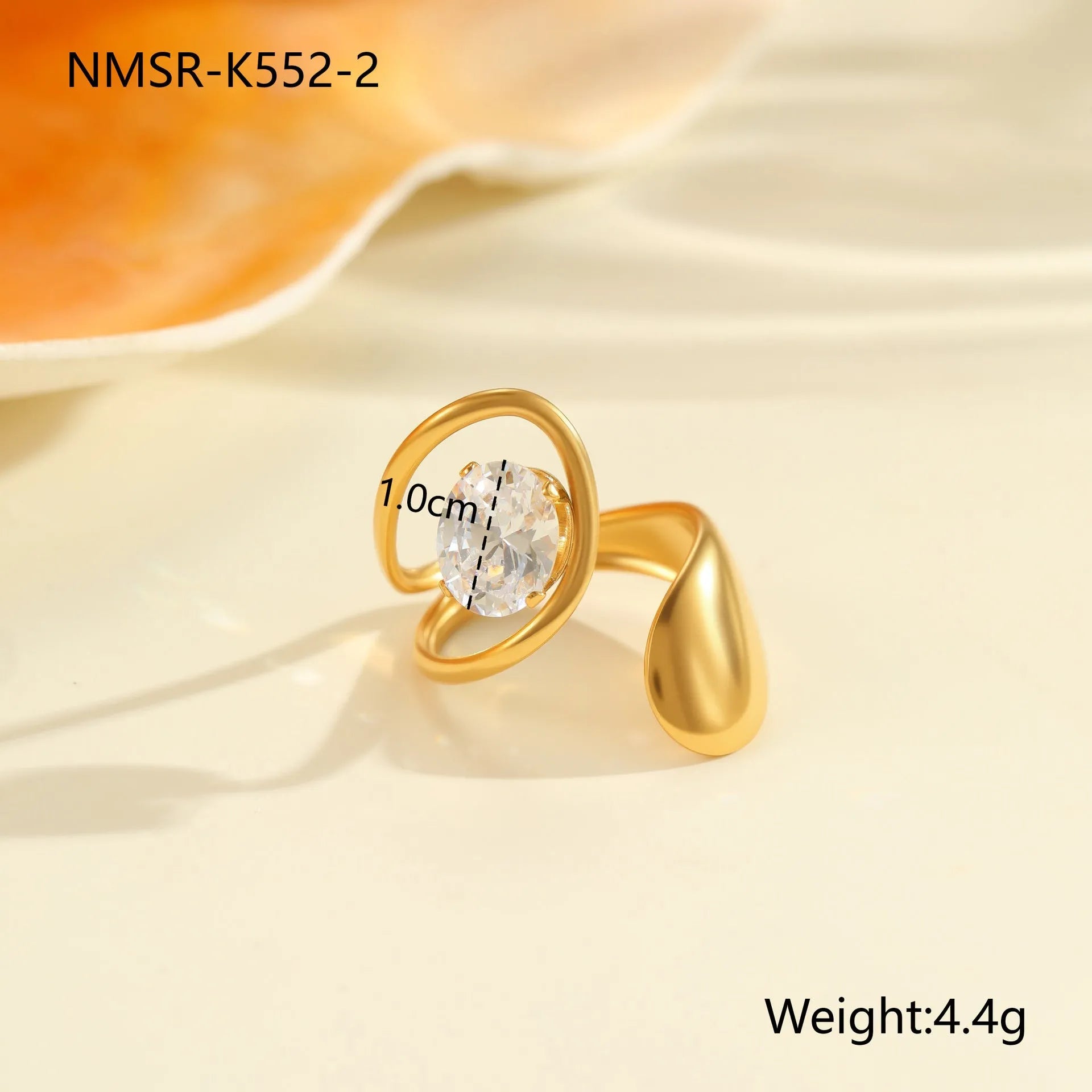Geometric zircon ring showing round, oval and quadrangular design elements in stainless steel with electroplated finish